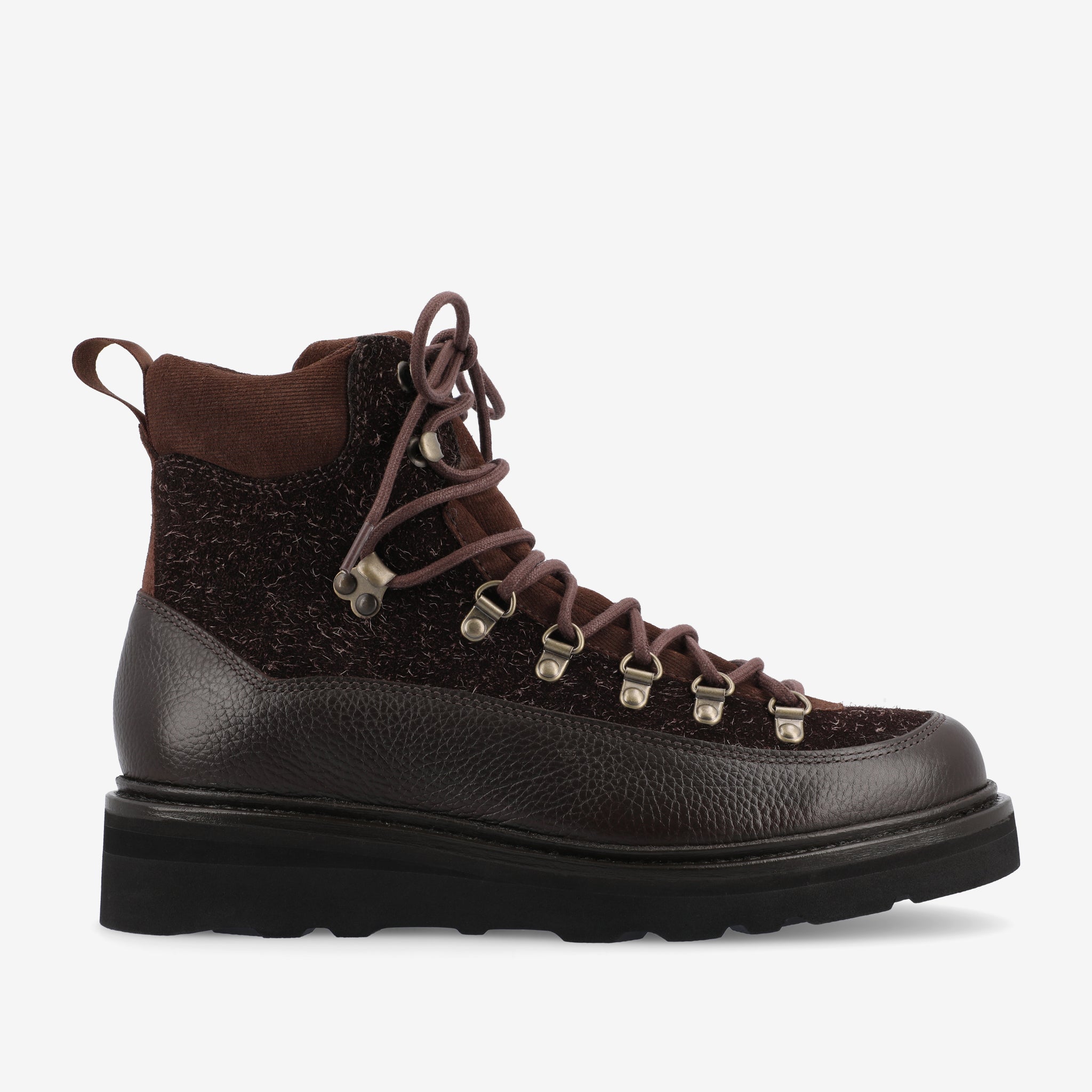 A single brown hiking boot with a textured upper, metal eyelets, and a pull tab at the back. The sole is thick with visible treading.