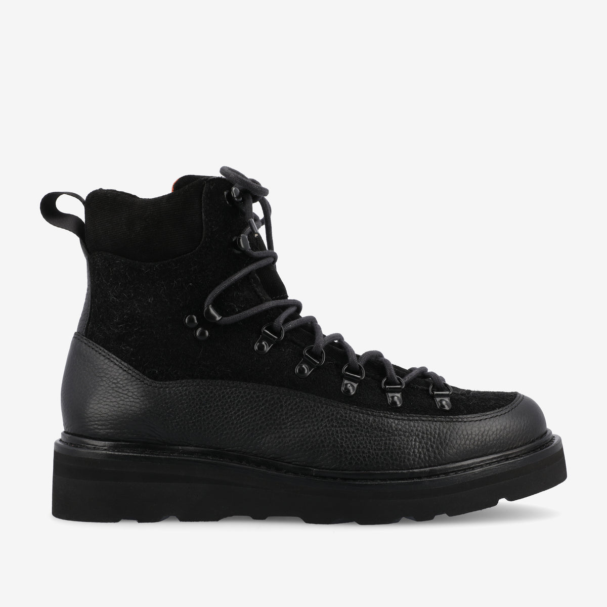 A black, ankle-high hiking boot with laces, metal eyelets, and a thick, textured sole. The boot has a loop at the back.