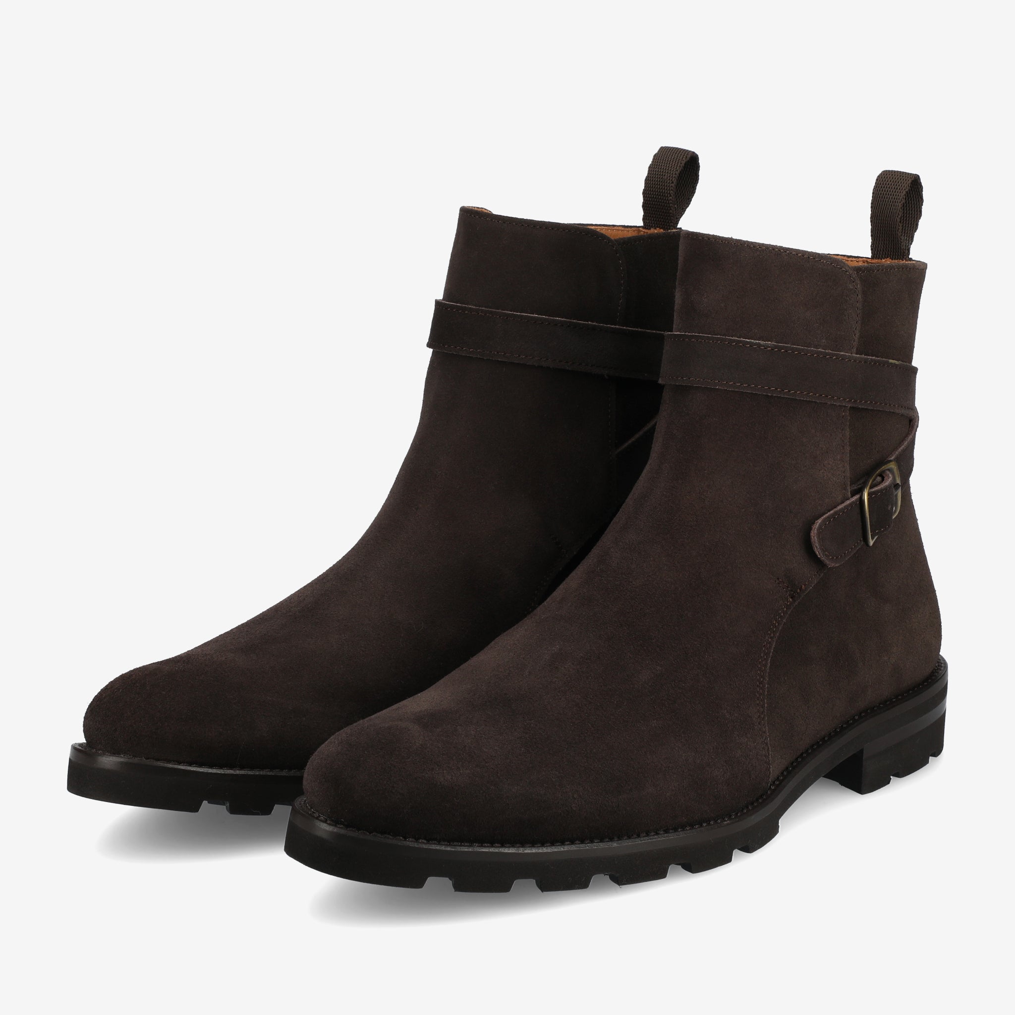 A pair of dark brown suede ankle boots with black soles and a side buckle strap.