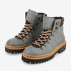 A pair of textured gray and black hiking boots with tan laces, metal eyelets, padded ankle collars, and thick black rubber soles.