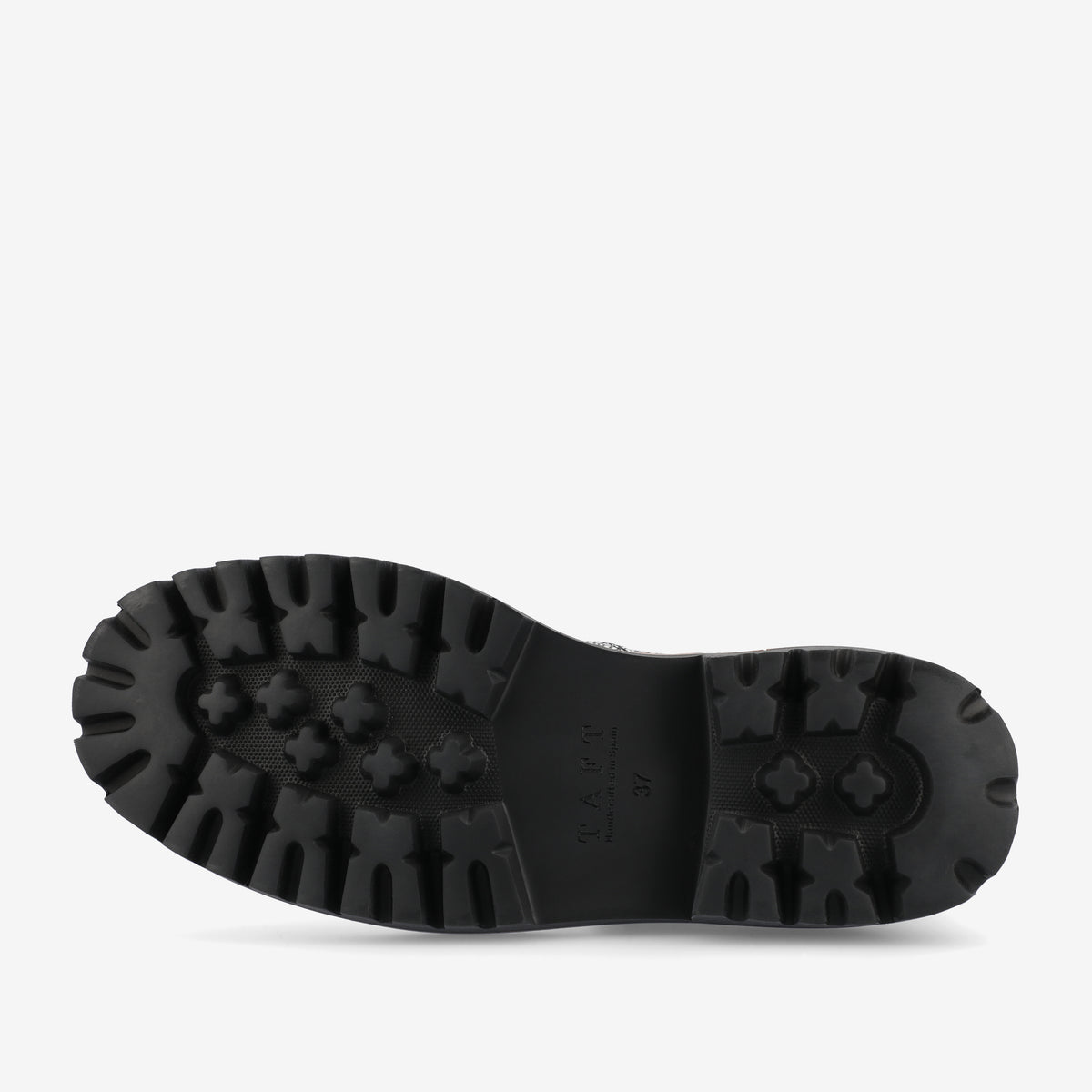 The image shows the sole of a black boot with deep tread.