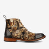 A camouflage-patterned lace-up boot with a brown leather toe cap, heel, and wooden sole, shown in a side view.