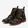 Black leather boots with a colorful dragonfly pattern, featuring brown laces, a tan wooden sole, and a rear pull tab on each heel.