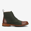 A dark green ankle-length boot with brown leather accents on the toe and heel, black laces, and a brown sole.