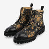 Black combat boots with a floral pattern in orange and white, featuring black toe caps and rugged soles.