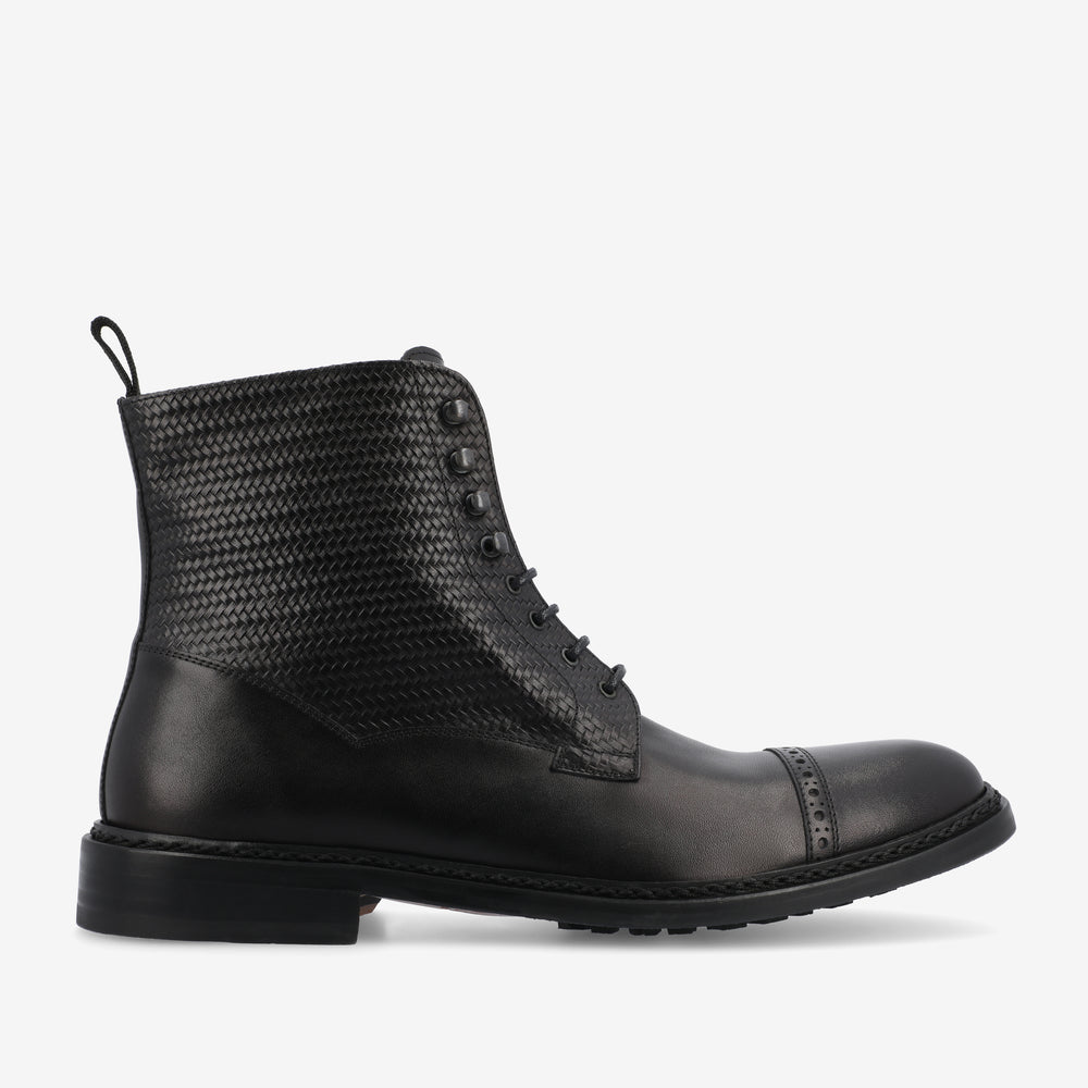 A black leather lace-up ankle boot with a textured upper, a capped toe, and a low heel, viewed from the side on a white background.