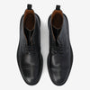 A pair of black leather dress shoes with textured design on the upper portion, laces, and a small pull tab on the back.