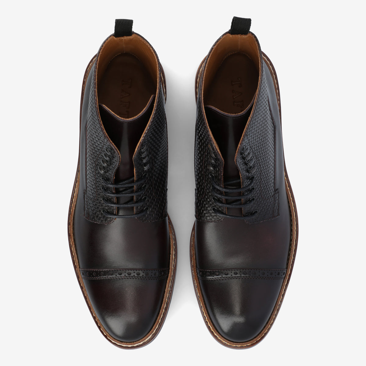 Top view of a pair of dark brown leather lace-up dress shoes with textured sides and a stitched toe cap detail.