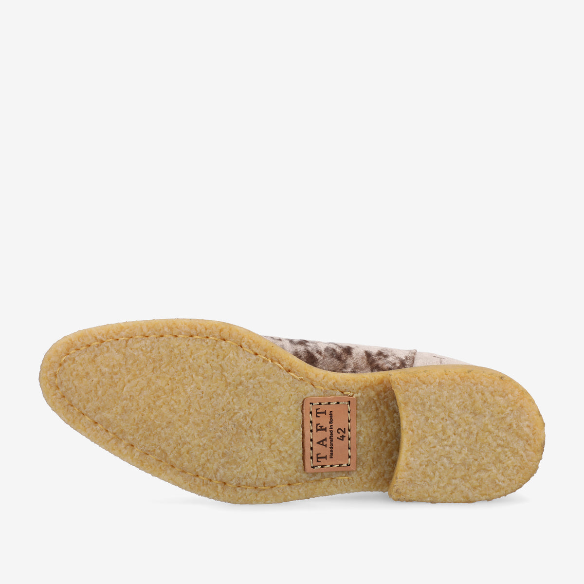 Bottom view of a shoe with a textured rubber sole, size 12. The brand name TAFT is embossed on a rectangular patch near the heel. The upper part of the shoe appears to be made of a patterned material.