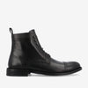 Black leather brogue ankle boot with a punctured wingtip design on the toe cap, lace-up front, and a pull-tab on the back.