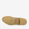 The sole of a beige shoe with a stitched edge and a TAFT logo stamp displaying the size.