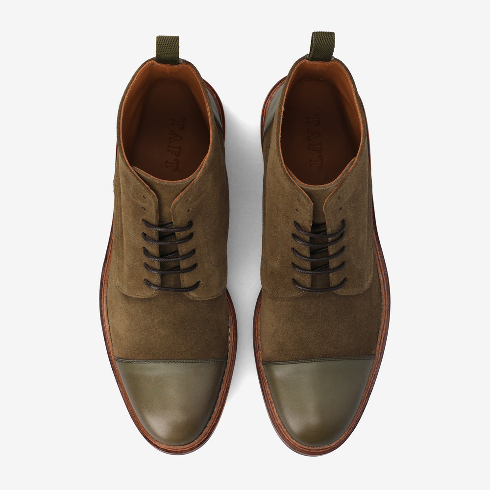 Top-down view of a pair of brown and olive leather and suede lace-up boots with a brown sole and TAFT branding inside.