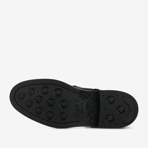 Black shoe sole with brand name 'TAFT' on a white background