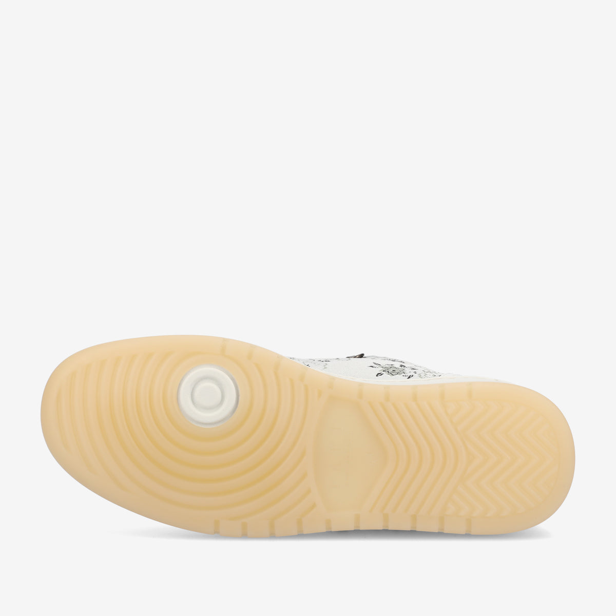 The image shows the sole of a sneaker, featuring a tread pattern with concentric circles and angular grooves, in a light beige color.