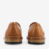 Rear view of a pair of tan leather loafers with patterned fabric inserts on a white background.