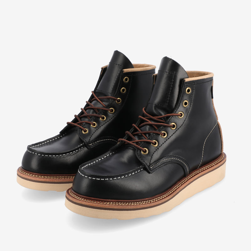 A pair of black leather lace-up boots with tan soles and white stitching details.