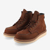 Brown leather work boots with white stitching and tan rubber soles, featuring a high-top design and lacing system.