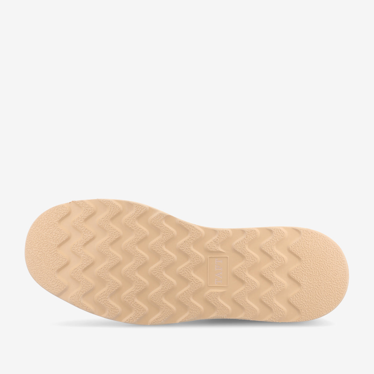 The image shows the beige sole of a shoe, featuring a textural, zigzag tread pattern designed for improved grip.