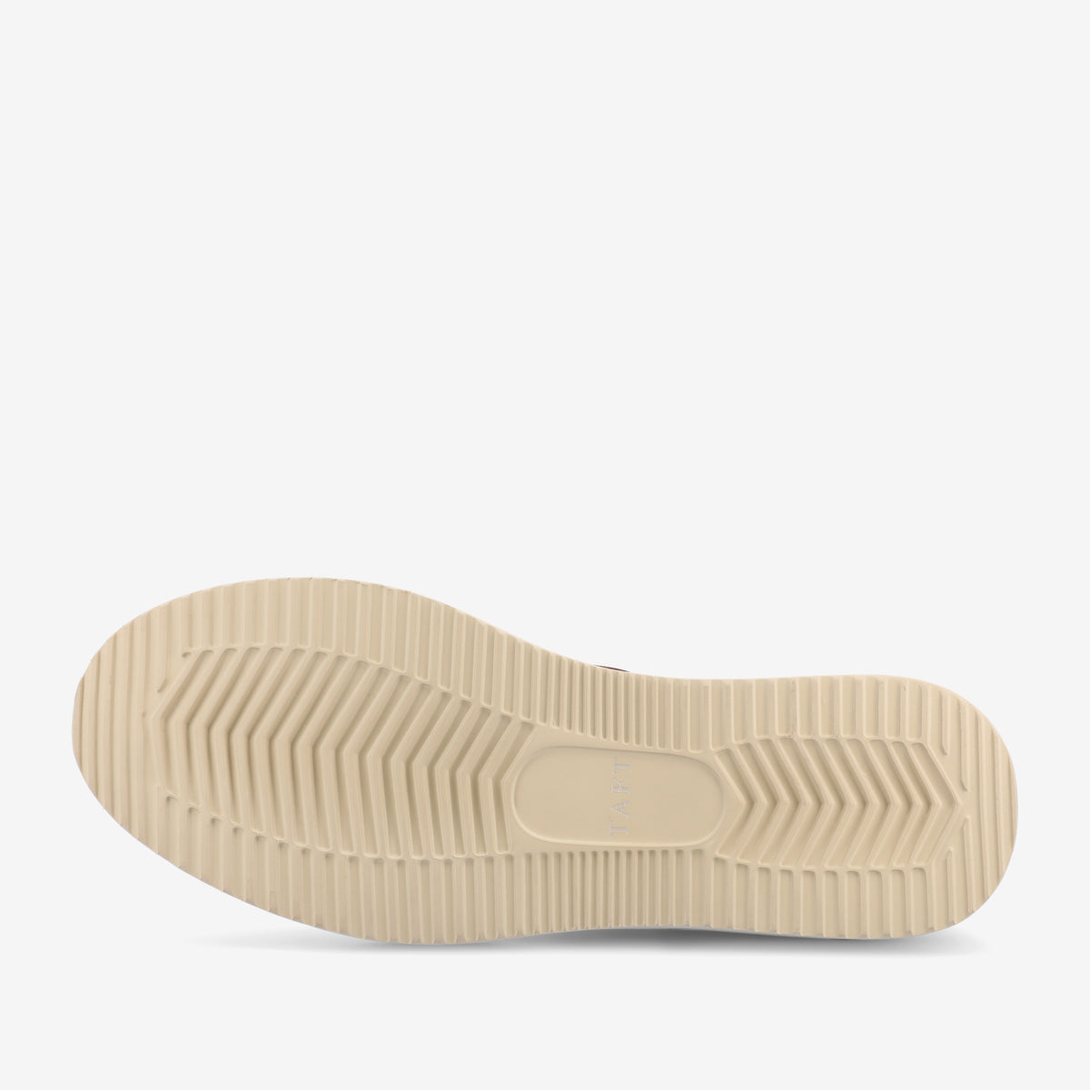 Sole of a beige shoe with a textured, non-slip pattern including ridges and grooves for traction.