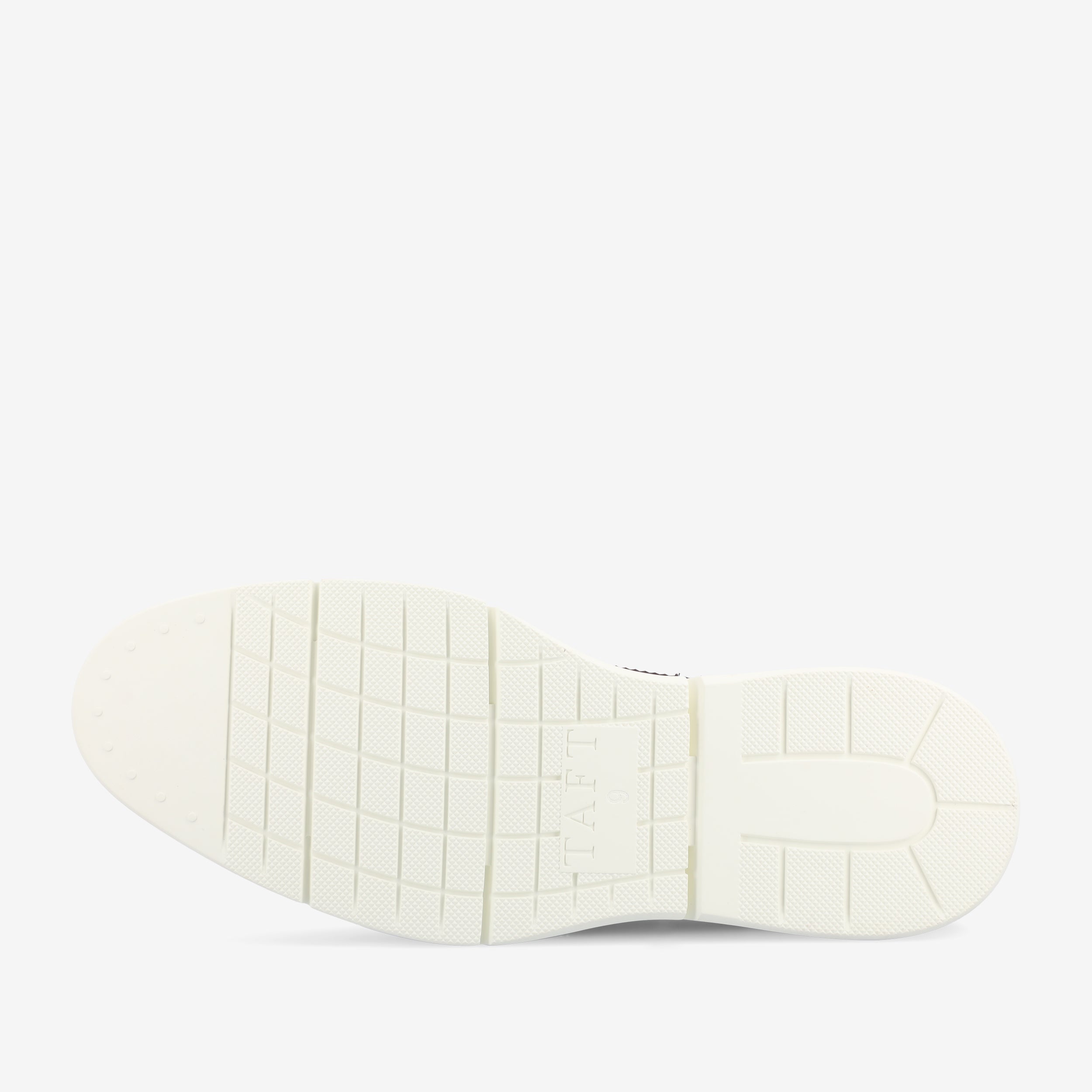 The image shows the underside of a white shoe sole with the word TAFT inscribed in the middle and a grid pattern covering most of the sole.