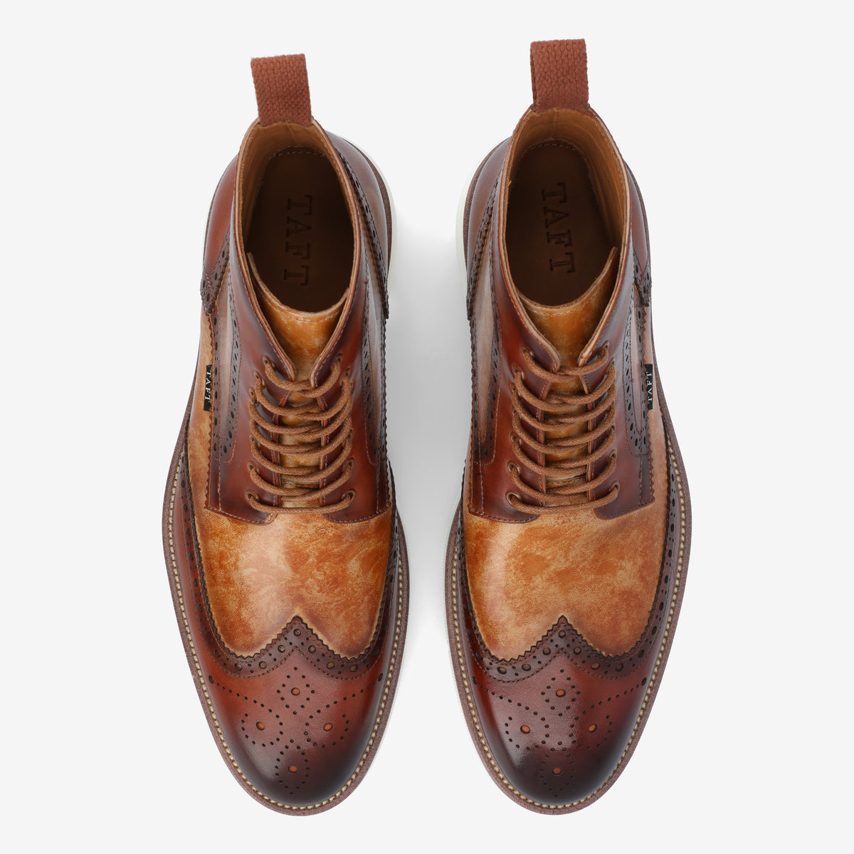 A pair of brown leather dress boots with brogue detailing, shown from above on a white background.