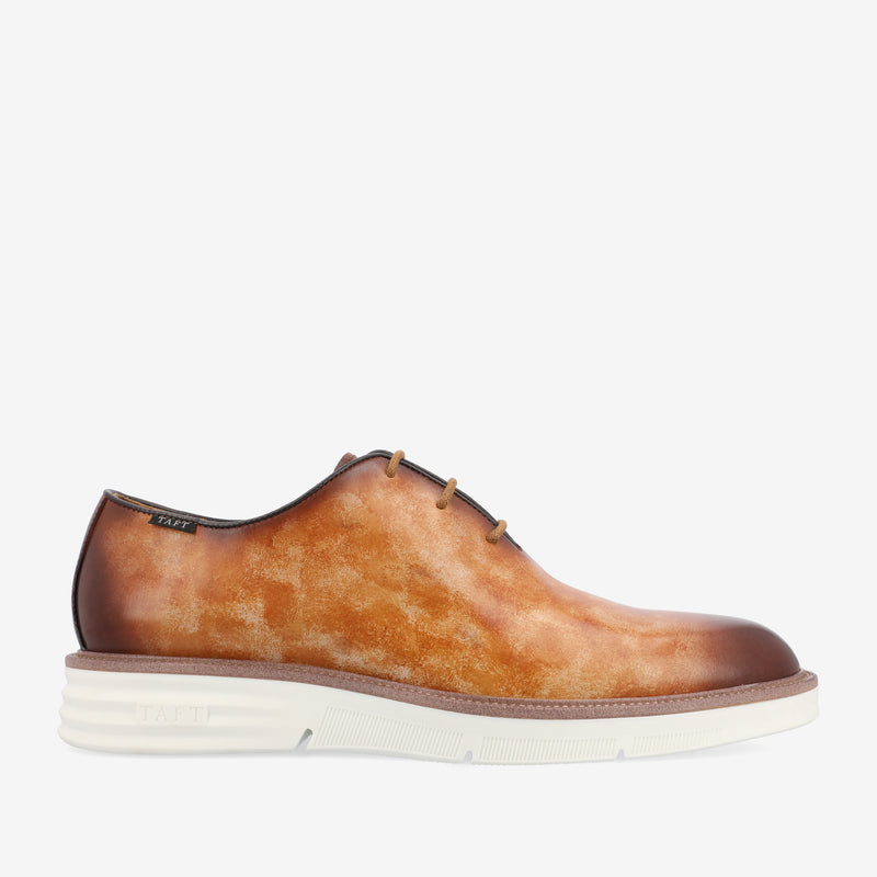 Men's oxford shoe with a burnished brown leather upper and a white rubber sole.