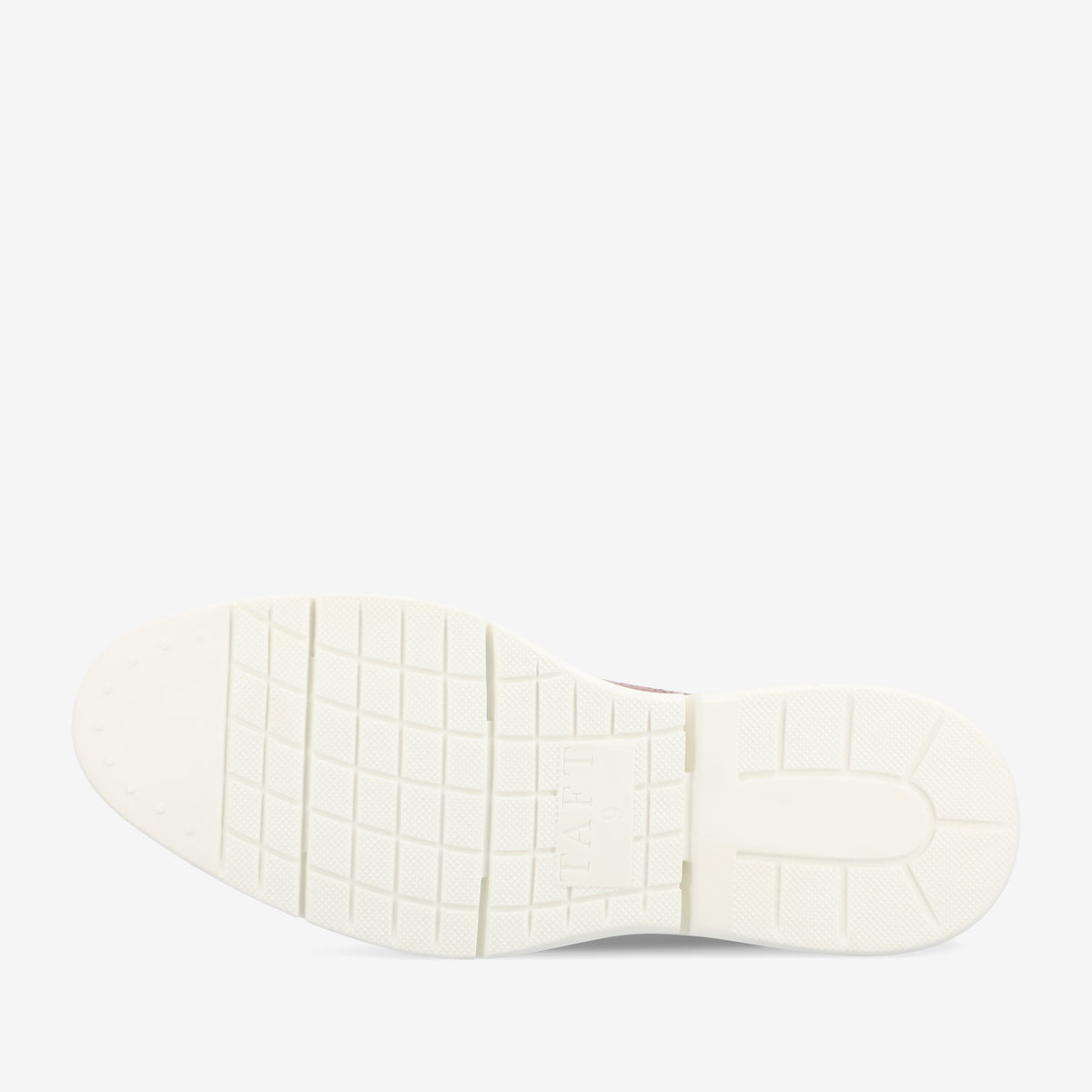 The image shows the white rubber sole of a shoe featuring a grid-like pattern with some text near the center.