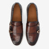 Top view of a pair of brown leather double monk strap shoes with white soles, brand name TAFT visible on the insides.