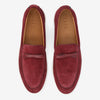 Pair of burgundy suede loafers with white soles and a bow detail on top, viewed from above. The brand name Taft is visible on the insole.