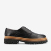 A black leather lace-up shoe with a thick, rugged tan and black sole.