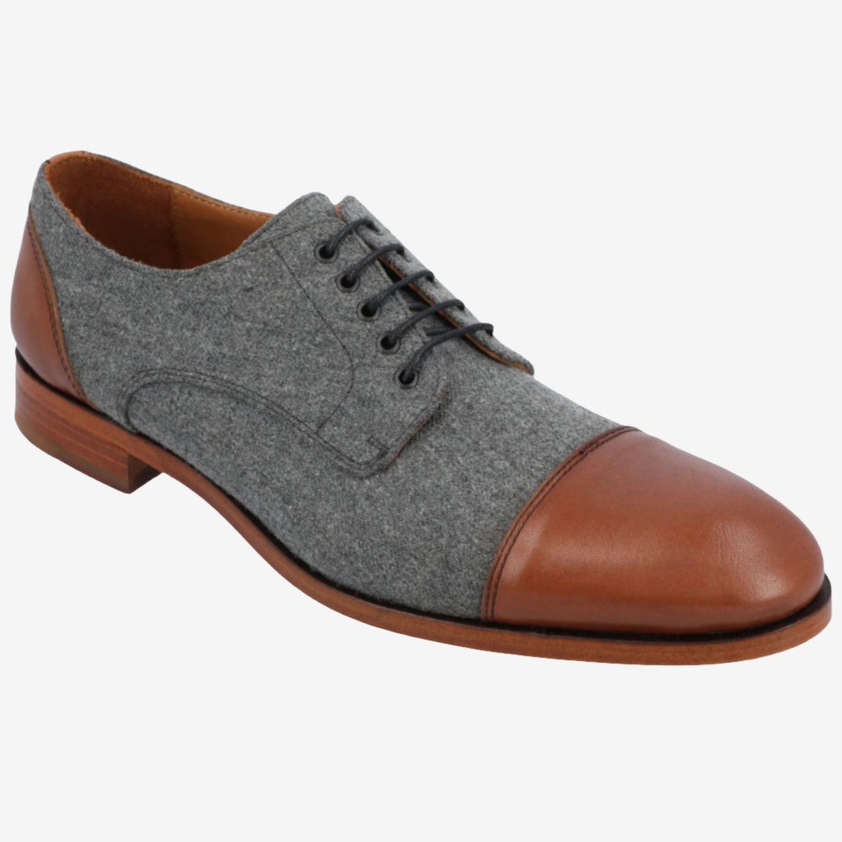 A gray and brown men's oxford shoe with a leather toe cap, laces, and wooden sole.