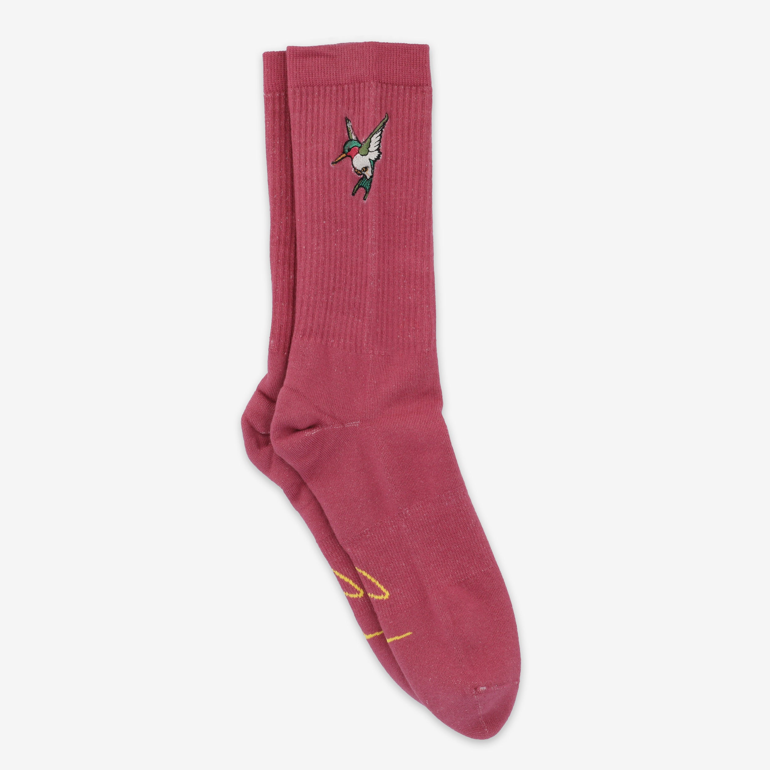 A pair of pink socks with a small embroidered hummingbird design near the top.