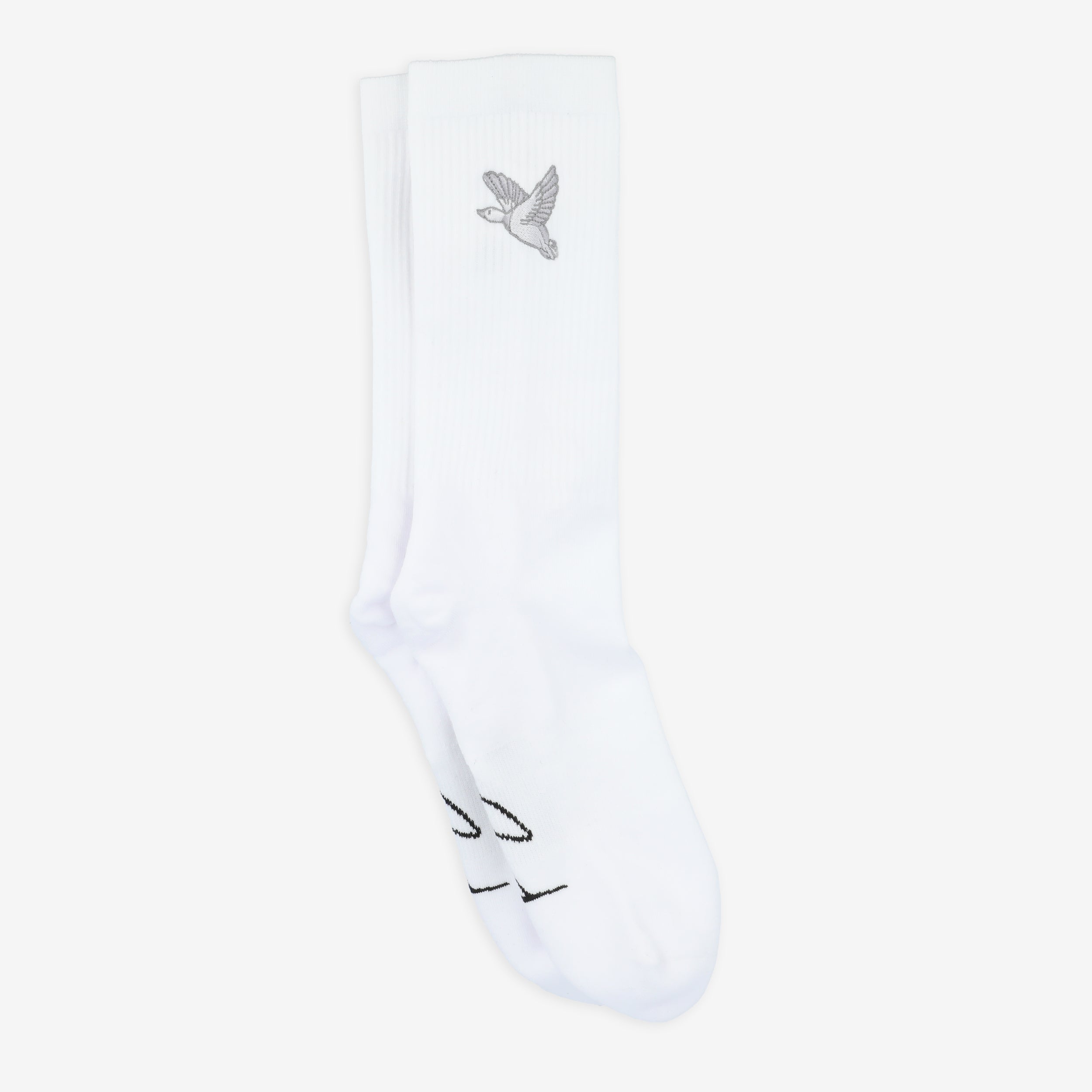 A pair of white socks with a small embroidered bird and black text near the toes.