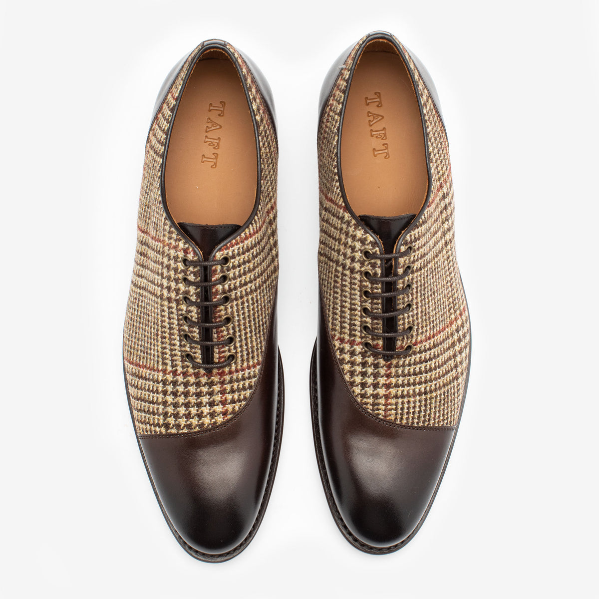 Pair of brown leather oxford shoes with houndstooth-patterned fabric uppers, viewed from above. The brand name TAFT is visible on the insoles.