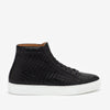 Black high-top sneaker with textured woven pattern and white rubber sole, viewed from the side against a white background.