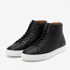 A pair of black high-top sneakers with a woven texture and white rubber soles, presented on a white background.