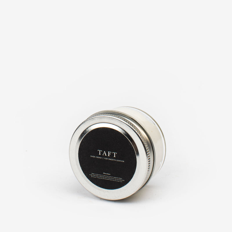 A small metal tin of TAFT shoe cream with a black label, featuring product details in white text.