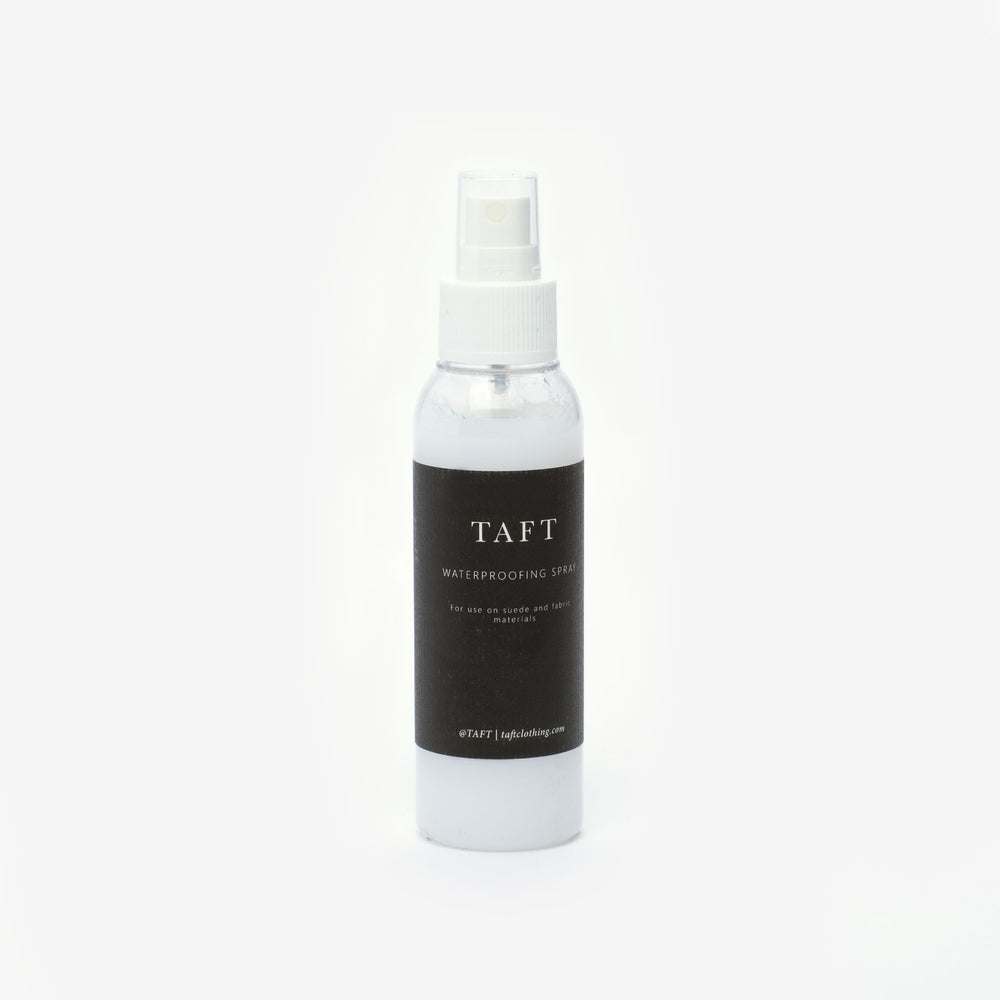 A white spray bottle labeled TAFT Waterproofing Spray with a black label and white text.