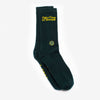 A pair of dark green socks features the yellow text Take Care of Yourself and a smiley face design.