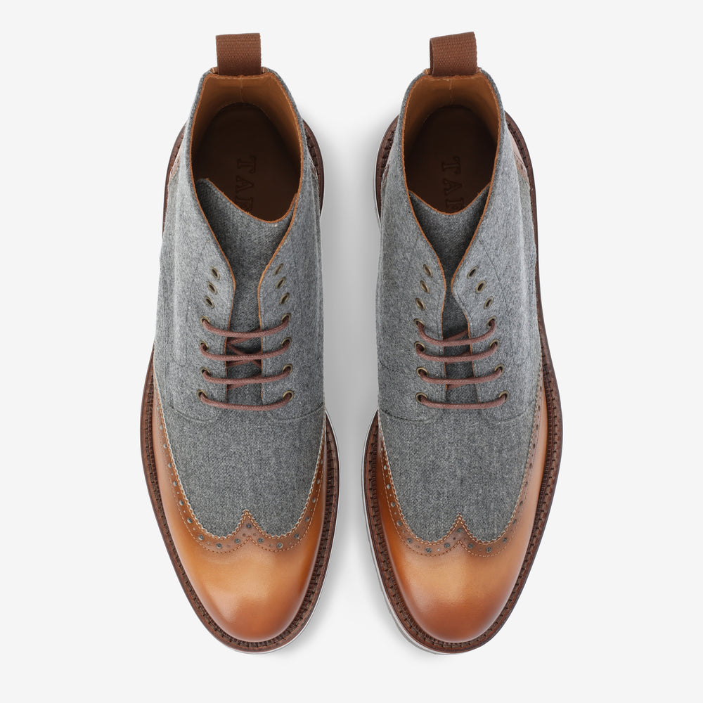 Pair of two-tone oxford shoes with grey fabric and tan leather, featuring brown laces, seen from the top.