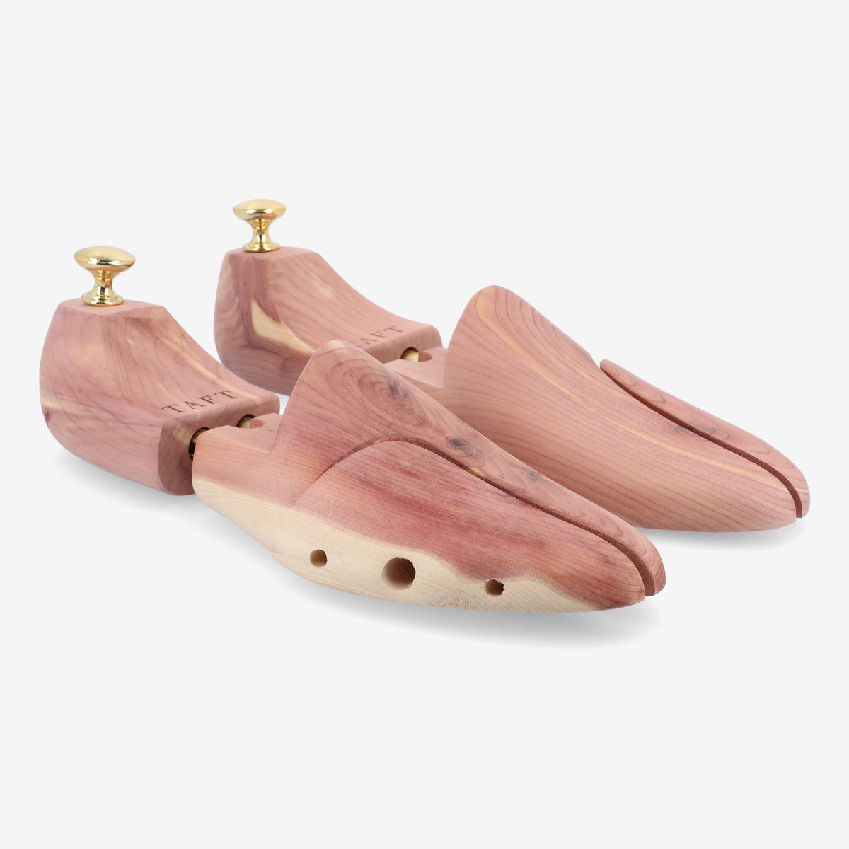 A pair of wooden shoe trees with detachable handles, featuring a natural wood finish and ventilation holes.