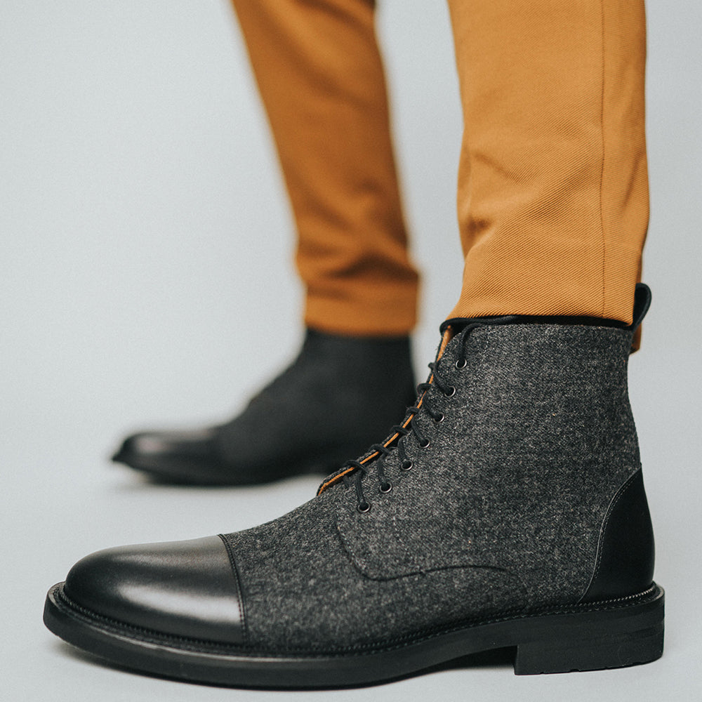 The Jack Boot in Black on model wearing tan pants {{featured-B}}
